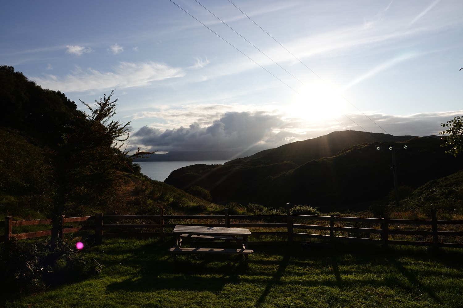 Evening sunlight over the bay from the garden at Torbeg Cottage
